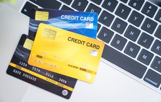 Many credit card on computer laptop